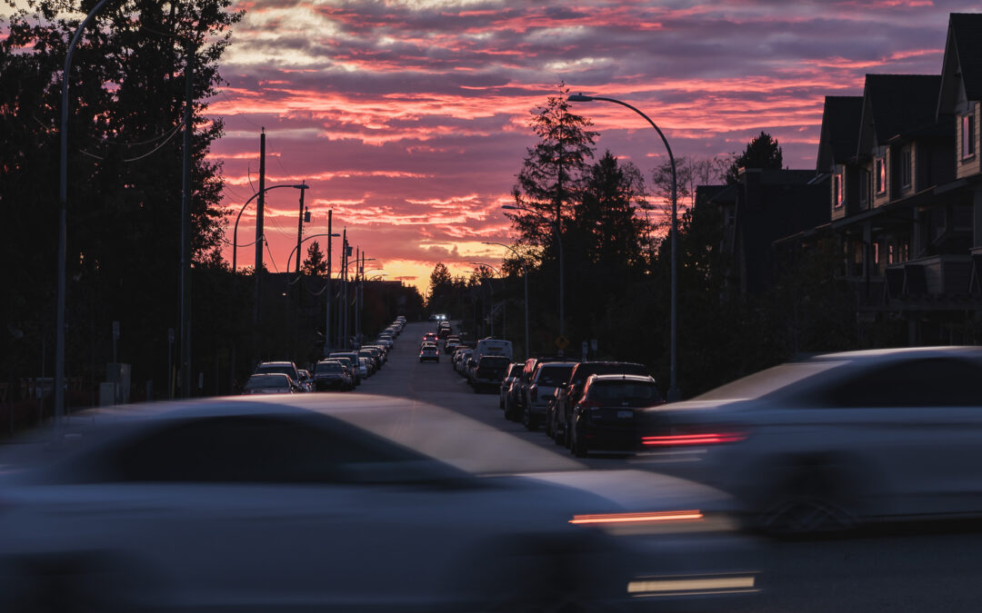 image of cars driving on the road at sunset to go with the blog What Are The Most Common Traffic Violations?